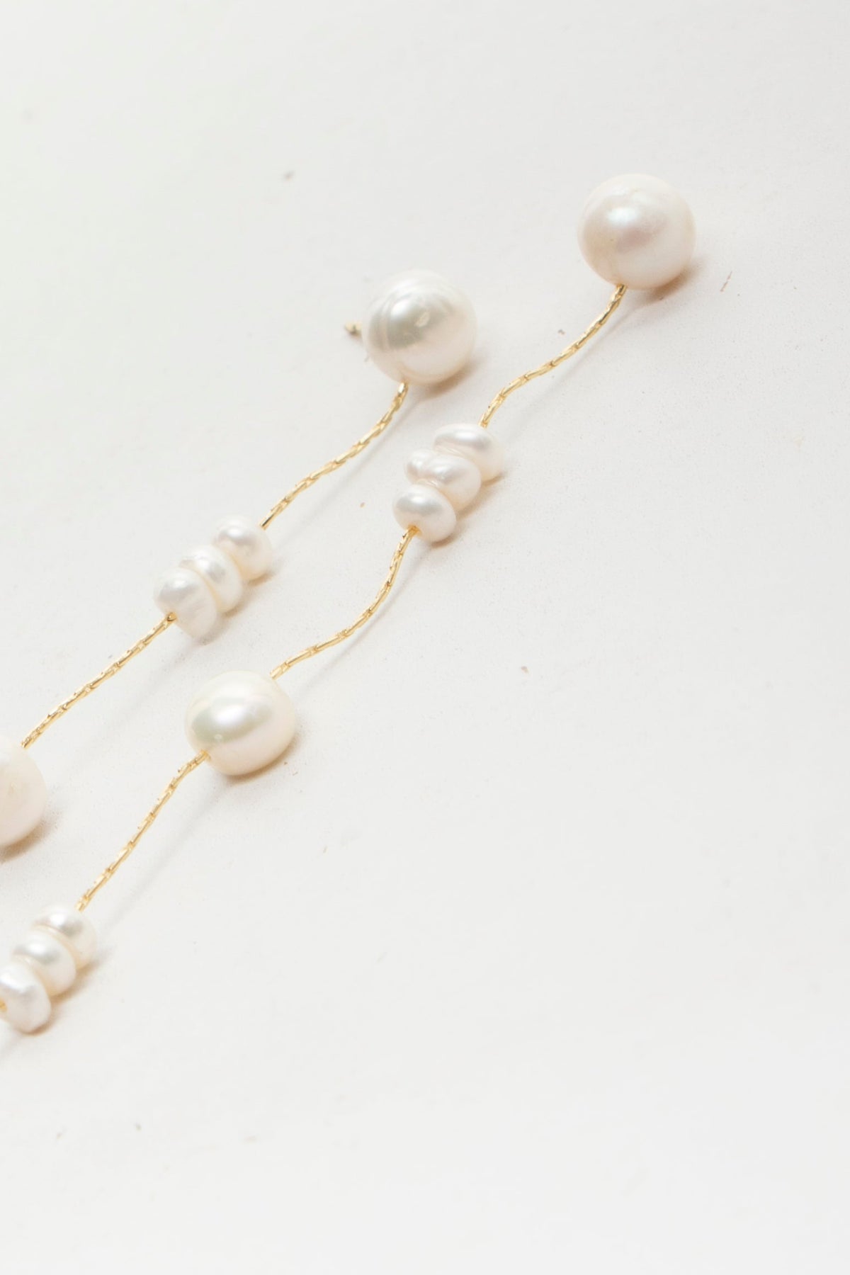 Aretes Pearl string